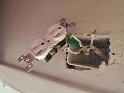 Duplex Outlet being Installed in a House Wall